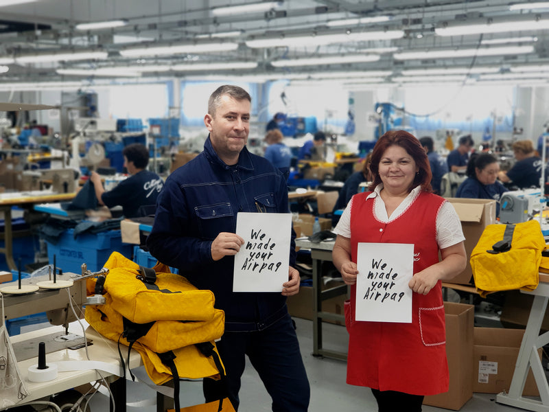 Romanian seamstresses in factory with sustainable backpacks